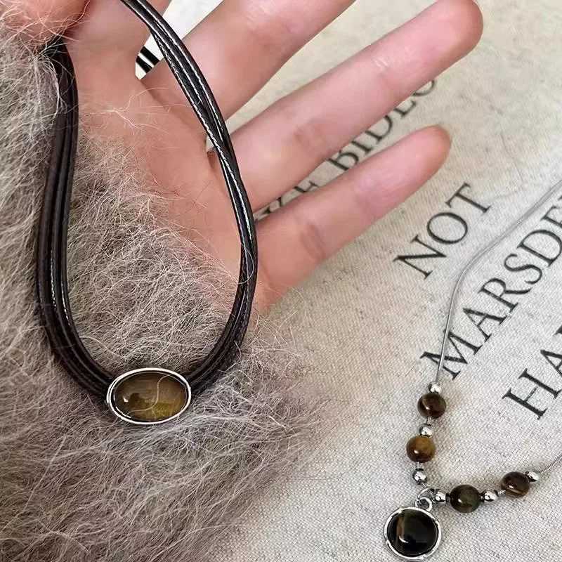 Фотография №1 товара Винтажное кожаное ожерелье с подвеской из коричневого камня, женское колье